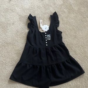 Black ruffle short romper. Size large. New with tags
